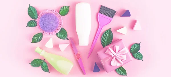 Banner Cosmetic packaging plastic bottle shampoo cream shower gel milk green leaves sponge box gift bow Natural organic product skin and hair care shopping Top view pink flat lay background.