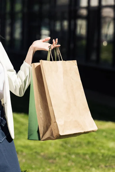 Partial View Female Hand Holding Shopping Bags Street — Stock Photo, Image