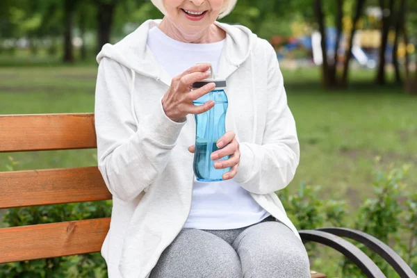 Cropped View Smiling Senior Woman Holding Sport Bottle — Stock Photo, Image