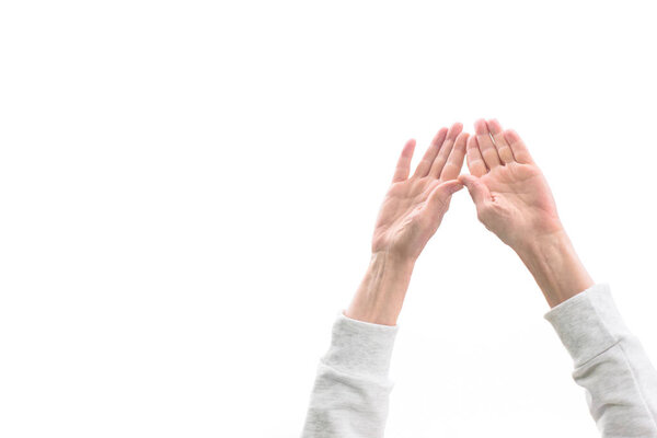 cropped view of woman with hands up, isolated on white