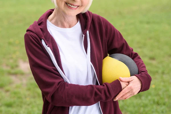 Cropped View Senior Sportswoman Medicine Ball — Free Stock Photo