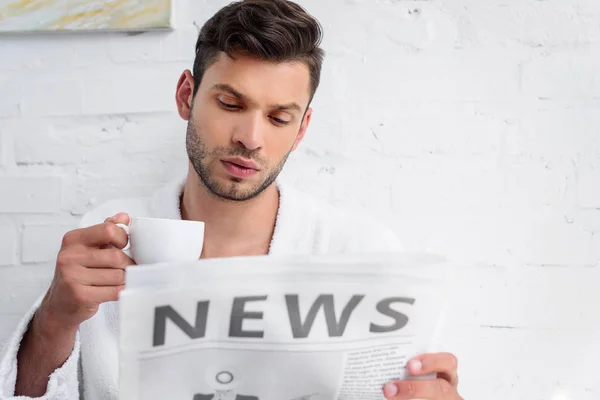 Young Man Cup Coffee Reading Newspaper Morning — Free Stock Photo