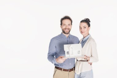 portrait of married couple with house model isolated on white clipart