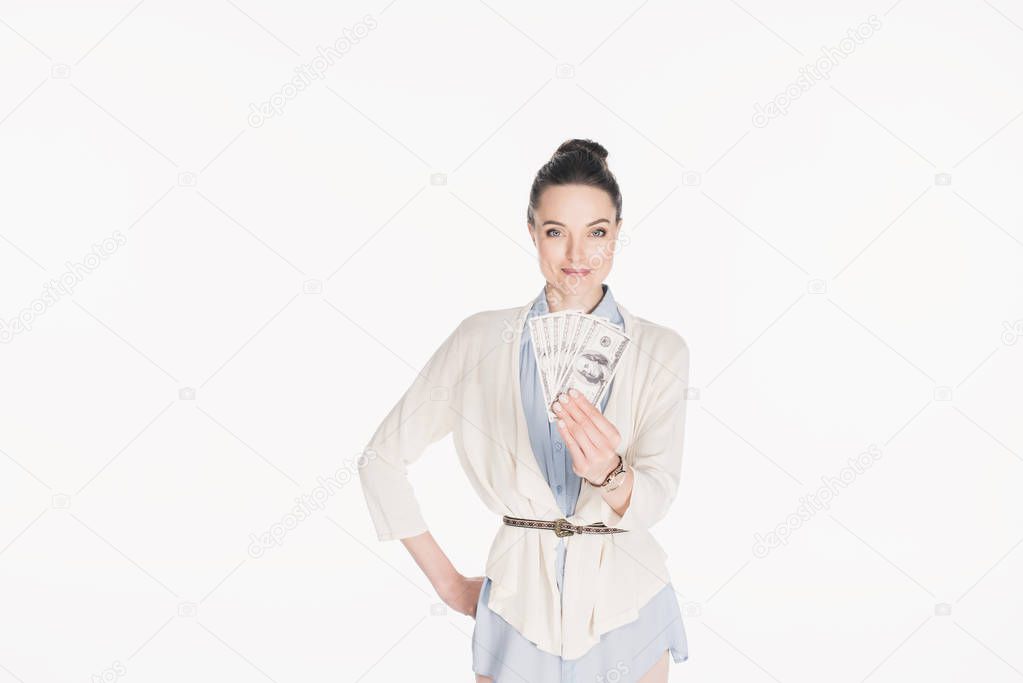 portrait of woman holding dollar banknotes in hand isolated on white