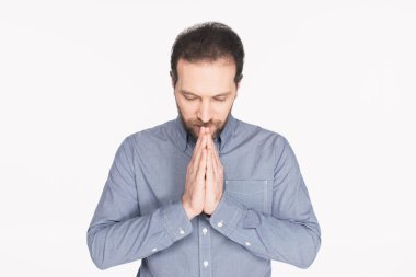 portrait of bearded man in shirt praying isolated on white clipart