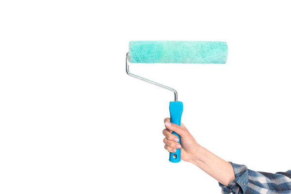 cropped image of woman holding paint roller isolated on white background