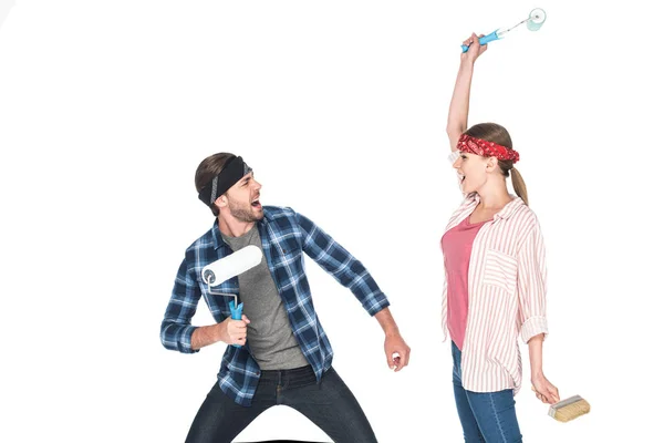 Screaming Couple Headbands Fighting Paint Rollers Isolated White Background — Stock Photo, Image