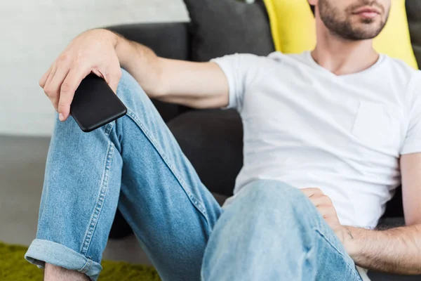 Cropped Image Man Smartphone Hand Sitting Floor Couch Home — Free Stock Photo