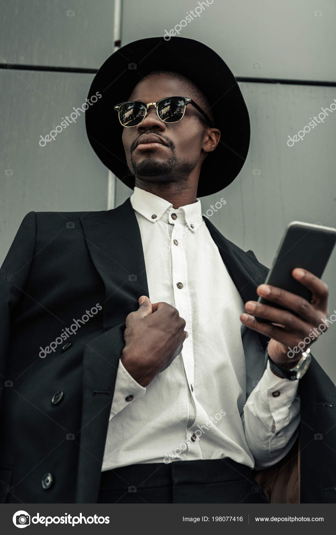 Stylish Businessman Wearing White Shirt Jacket Holding Smartphone