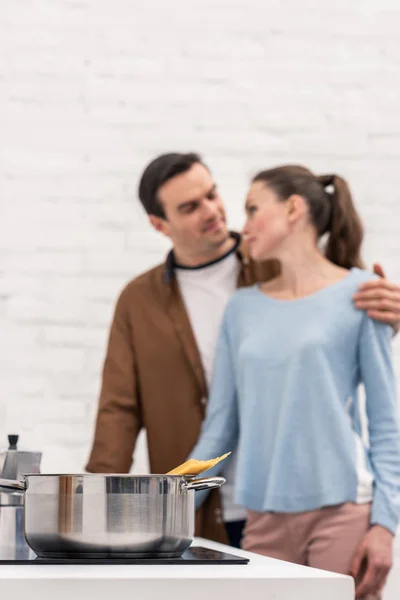 Close Shot Spaghetti Cooking Pan While Beautiful Adult Couple Embracing — Free Stock Photo