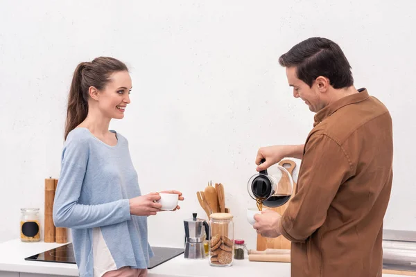 Handsome Man Pouring Coffee Wife Himself Morning — Free Stock Photo