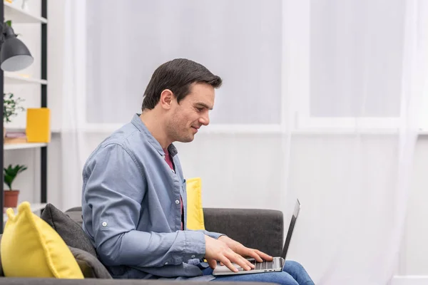 Side View Handsome Adult Man Using Laptop Couch Home — Stock Photo, Image