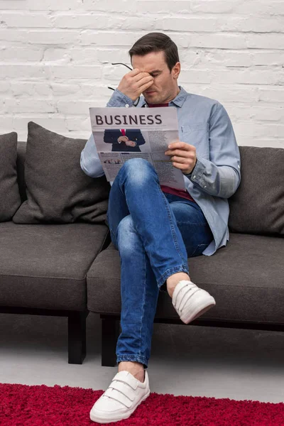 Exhausted Adult Man Rubbing Eyes While Reading Newspaper — Stock Photo, Image