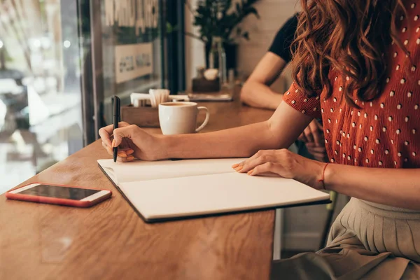 Partial View Blogger Making Notes Notebook Table Cup Coffee Coffee — Stock Photo, Image