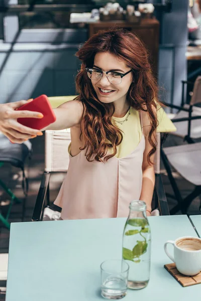 Portrait Smiling Woman Eyeglasses Taking Selfie Smartphone Cafe — Stock Photo, Image