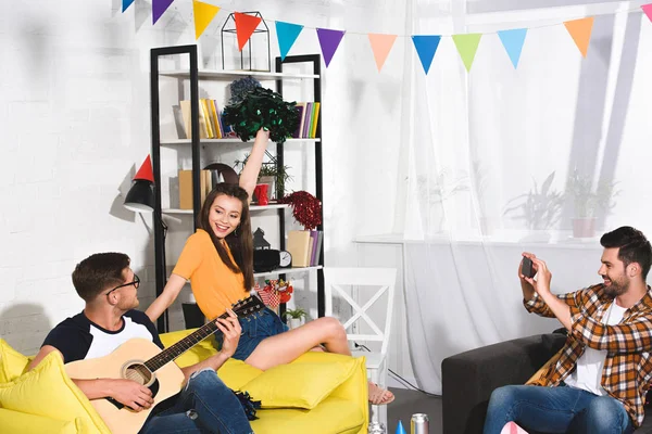 Man Smartphone Photographing Friends Playing Guitar Singing Home Party — Stock Photo, Image