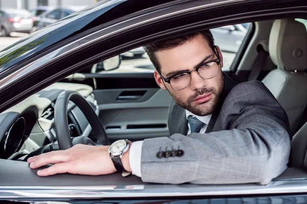 Side View Pensive Businessman Eyeglasses Looking Away While Driving Car — Free Stock Photo