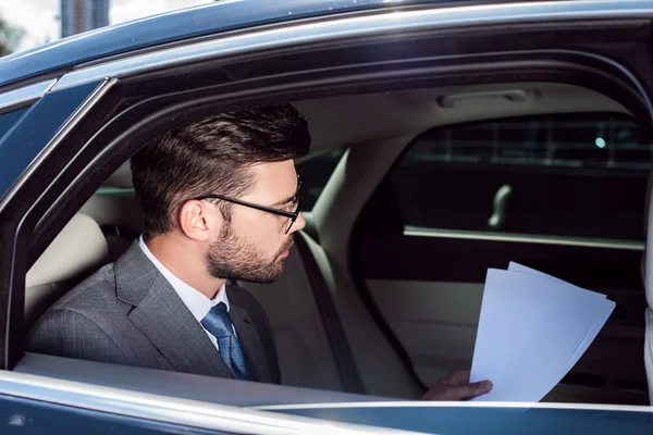 Side View Serious Businessman Working Documents Backseat Car — Stock Photo, Image