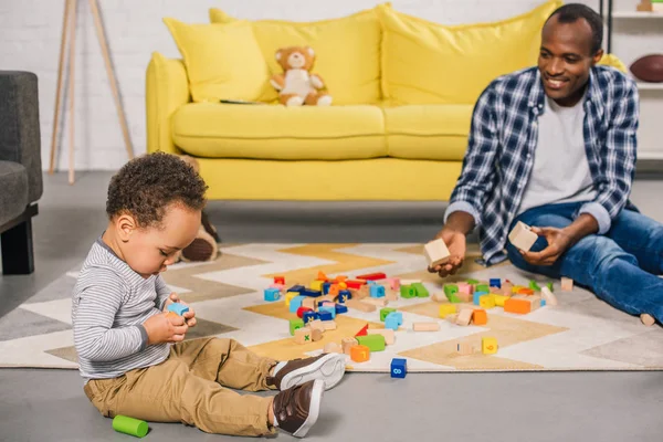 Smiling Young Father Looking Adorable Child Playing Colorful Blocks Home — Stock Photo, Image