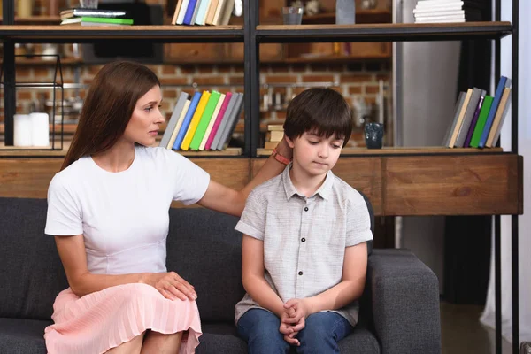 Selective Focus Mother Cheering Depressed Little Son Sofa Home — Stock Photo, Image