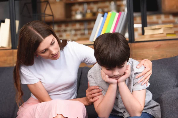 Selective Focus Mother Cheering Depressed Little Son Sofa Home — Stock Photo, Image