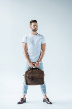 Handsome bearded man carrying briefcase on white background clipart