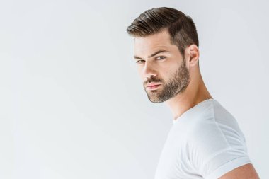 Stylish young brunette bearded man isolated on white background