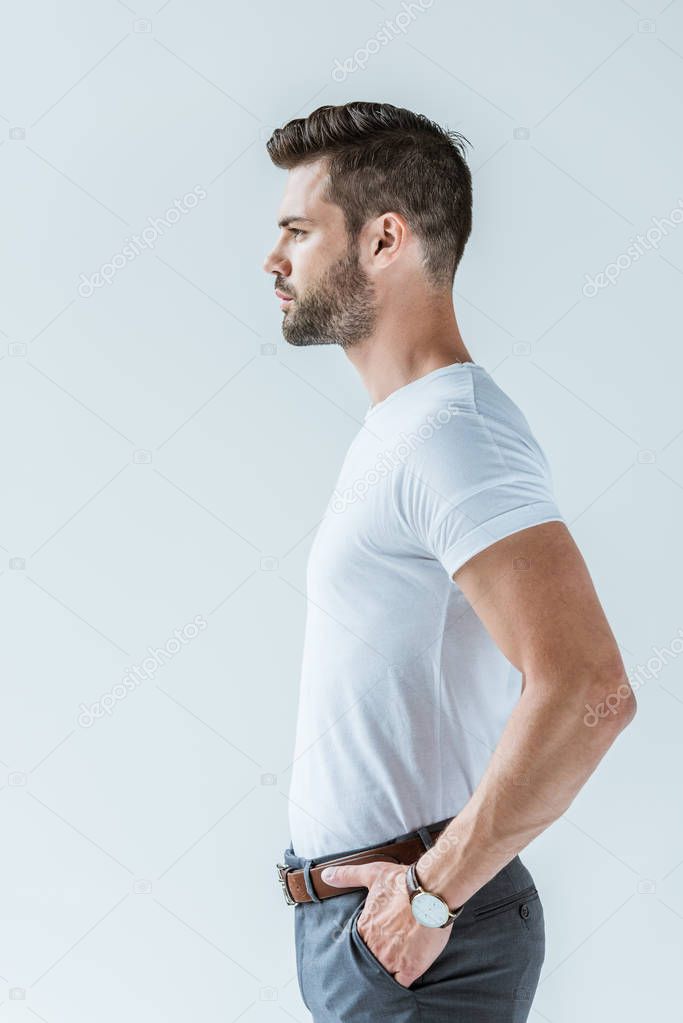 Profile view of handsome bearded man isolated on white background