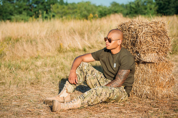 Young African American Soldier Military Uniform Sunglasses Resting Hay Range Stock Photo