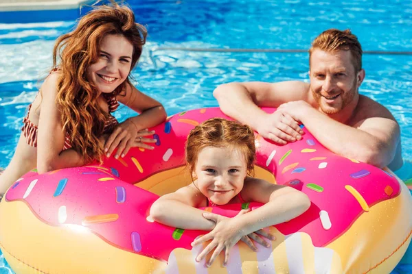 Happy Young Parents Daughter Floating Rubber Ring Looking Camera Swimming — Stock Photo, Image