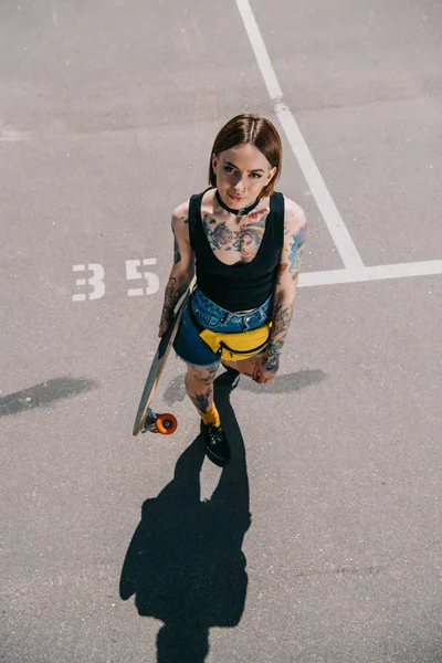 High Angle View Stylish Tattooed Girl Holding Skateboard Looking Camera — Stock Photo, Image