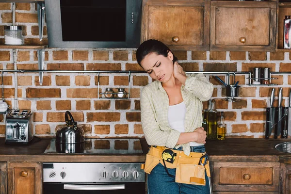 Tired Young Repairwoman Pain Neck Leaning Back Kitchen Table — Stock Photo, Image
