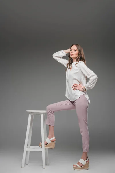 Attractive Female Model Posing Leg Chair Grey Background — Stock Photo, Image