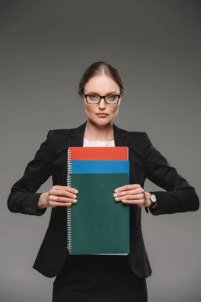 Serious Female Teacher Eyeglasses Holding Textbooks Isolated Grey Background — Stock Photo, Image
