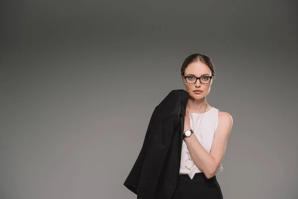 Portrait Businesswoman Eyeglasses Holding Jacket Isolated Grey Background — Stock Photo, Image