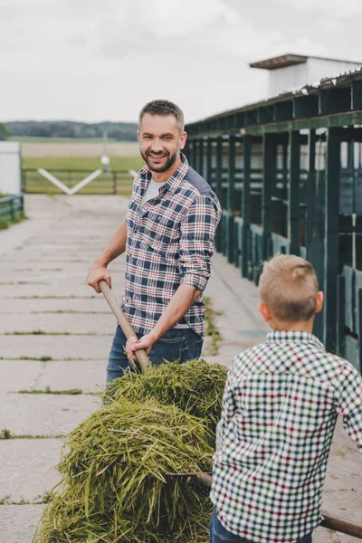 Father Son Checkered Shirts Working Together Farm — Free Stock Photo