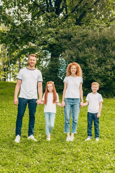 Happy Family Two Kids Holding Hands Smiling Camera Park — Stock Photo, Image