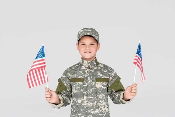 Portrait Smiling Child Military Uniform American Flagpoles Hands Isolated Grey — Stock Photo, Image