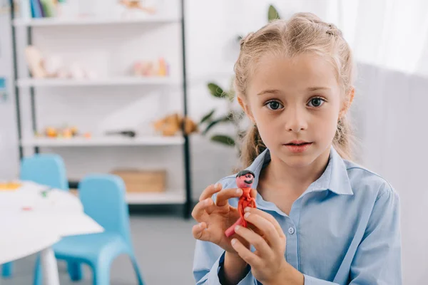 Portrait Little Kid Plasticine Hands Looking Camera Classroom — Free Stock Photo