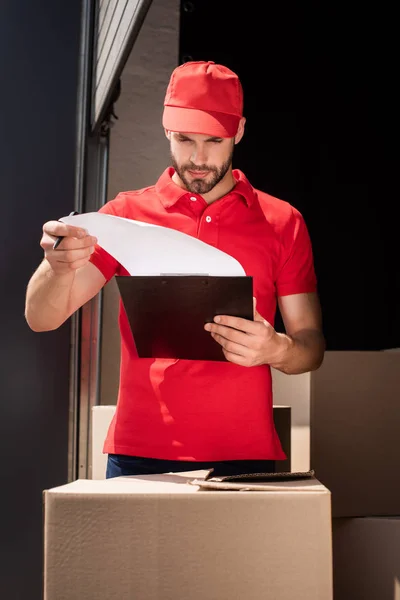Portrait Delivery Man Uniform Checking Notes Notepad — Stock Photo, Image