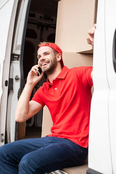 Smiling Delivery Man Red Uniform Talking Smartphone While Resting Van — Stock Photo, Image