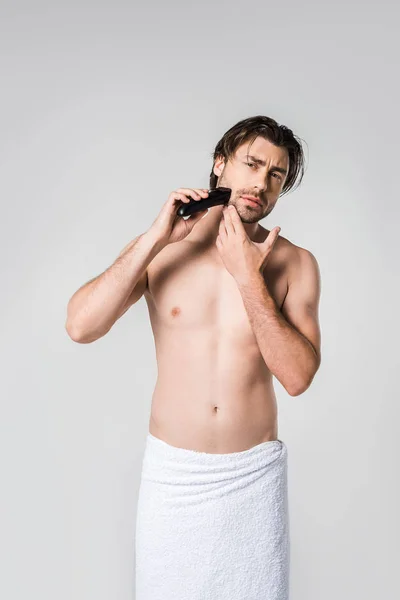Portrait Man White Towel Shaving Beard Electric Clipper Isolated Grey — Stock Photo, Image