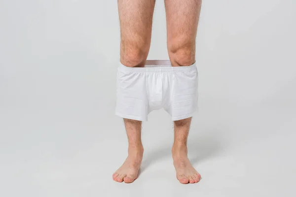 Cropped Shot Man Slipped White Underwear Grey Backdrop — Free Stock Photo