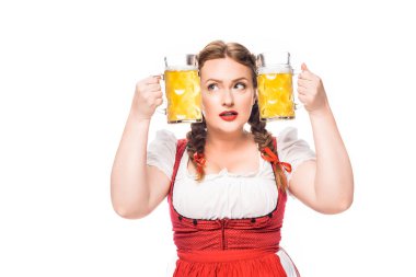 oktoberfest waitress in traditional bavarian dress putting head between mugs of light beer isolated on white background clipart