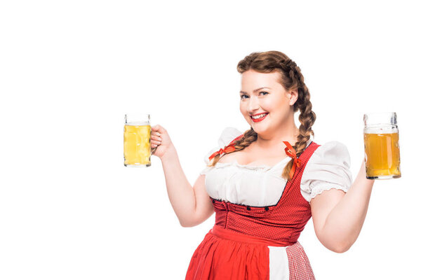 happy oktoberfest waitress in traditional bavarian dress holding mugs of light beer isolated on white background