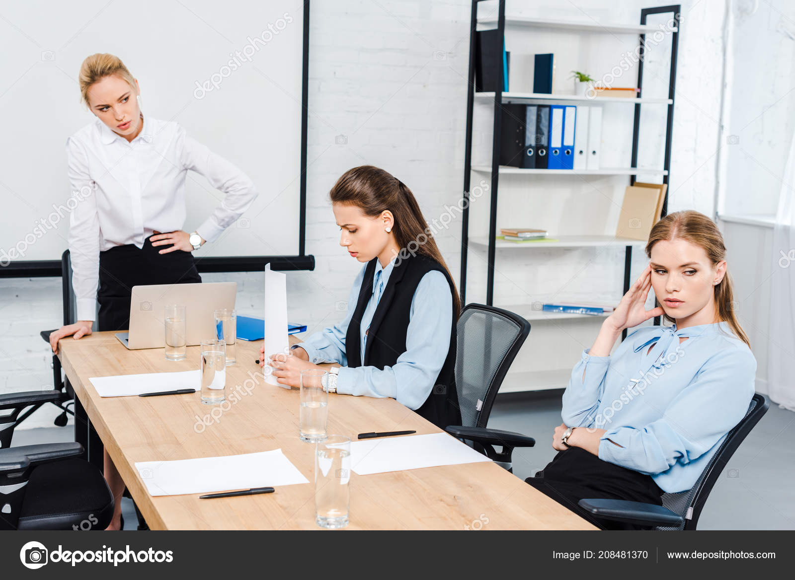 Angry Lady Boss Talking Depressed Female Employees Modern Office Stock  Photo by ©IgorVetushko 208481370