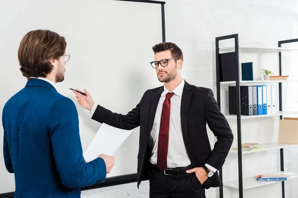 Successful Businessmen Having Conversation Pointing Presentation Board Modern Office — Stock Photo, Image