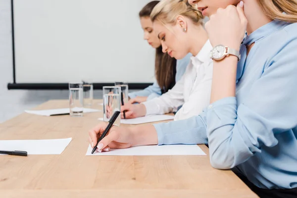 Cropped Shot Young Businesswomen Sitting Conference Hall Writing Documents — Stock Photo, Image