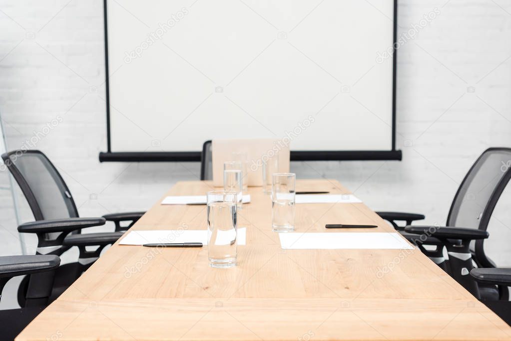 interior of empty conference hall with blank presentation board