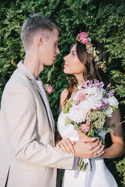 traditional wedding couple looking at each other